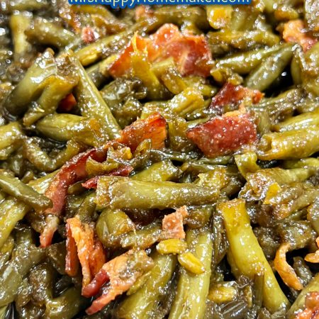 Crack green beans with bacon in a skillet