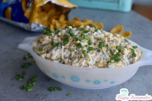 Creamy Mexican corn dip in a vintage blue and white Pyrex dish