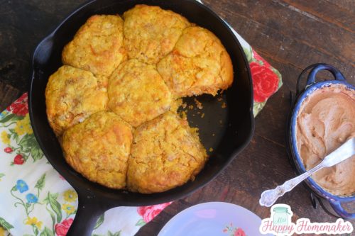A cast iron skillet full of sweet potato biscuits