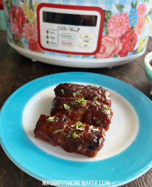 BBQ county style ribs on a blue rimmed vintage Pyrex plate