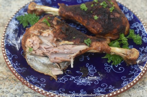The inside meat of a turkey leg on a blue plate