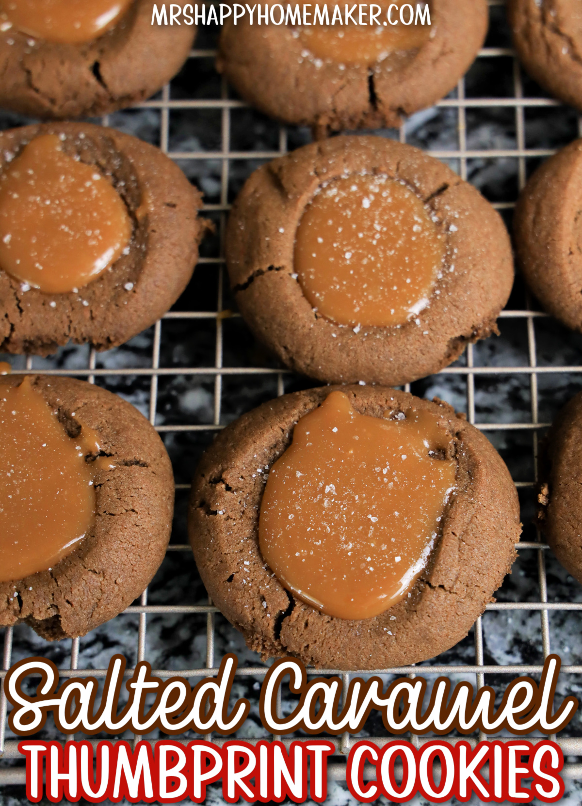 Salted caramel thumbprint cookies on a wire rack