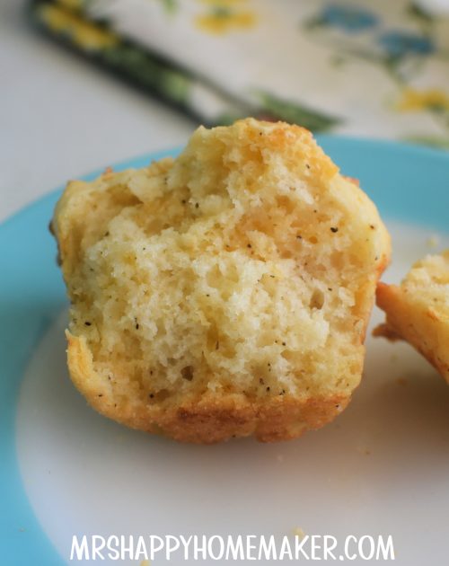 Cracked Pepper Cheddar Muffins on a blue rimmed plate