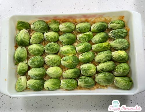 Brussels sprouts in a white rectangle baking dish