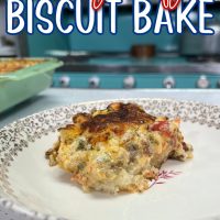 Cheesy Beefy Biscuit Casserole in a white bowl with a blue stove behind it