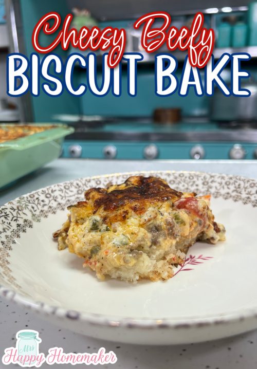 Cheesy Beefy Biscuit Casserole in a white bowl with a blue stove behind it