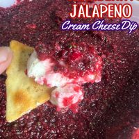 Cranberry Jalapeno Cream Cheese Dip on a cracker
