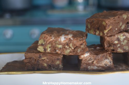 Rocky road fudge on a rectangle plate with a blue stove in the background