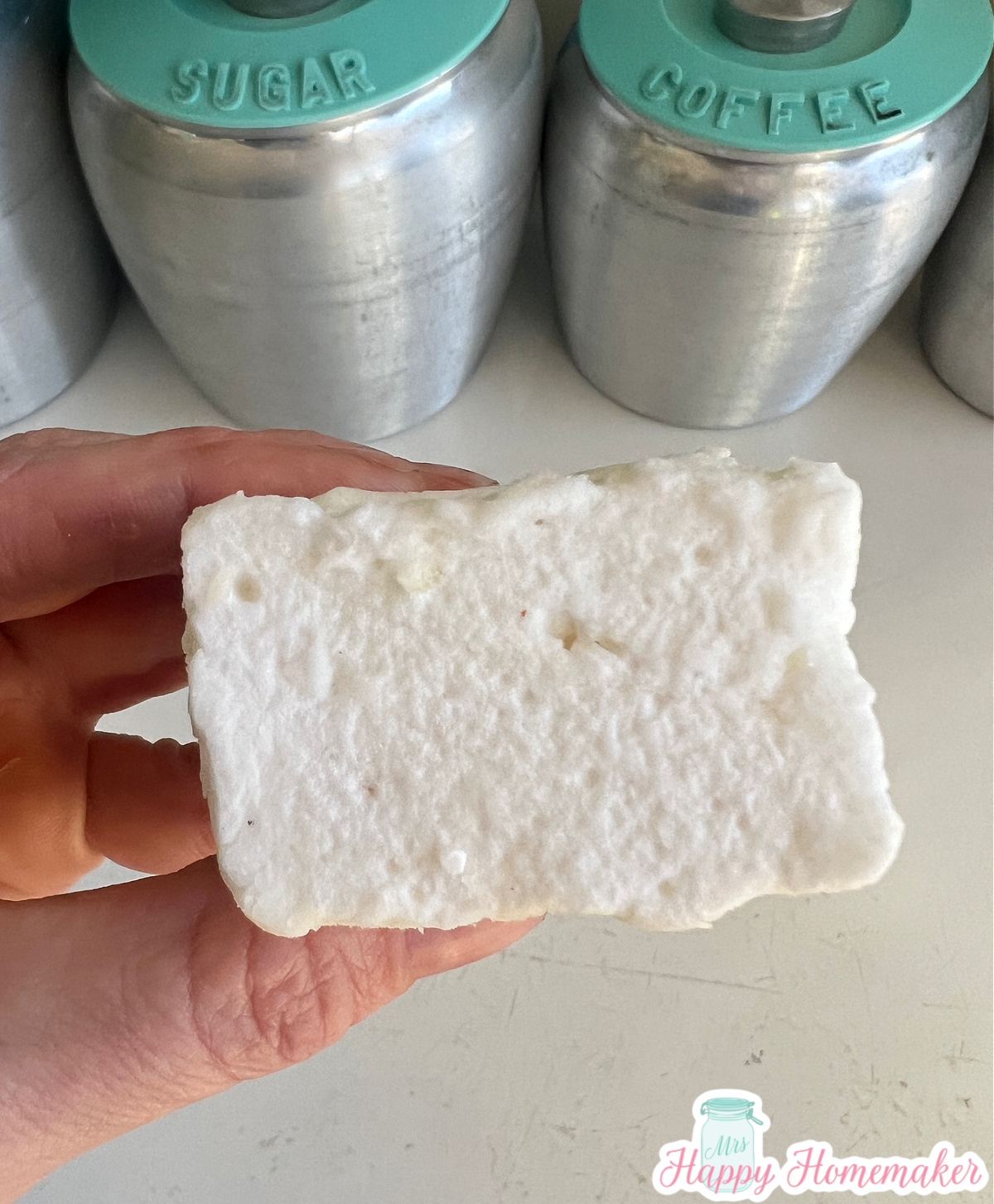Homemade marshmallow being held in a hand 