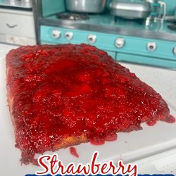 Strawberry Upside Down cake with a blue stove in the background