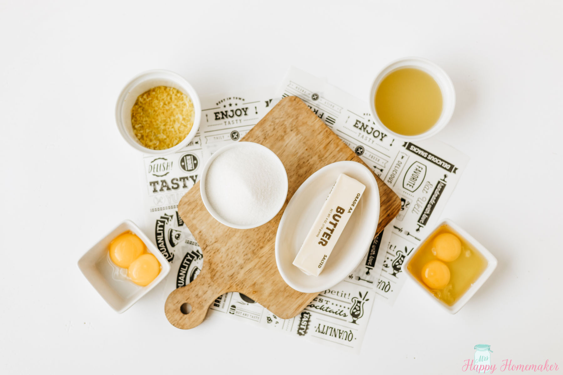 Lemon Curd ingredients laid out on a white counter