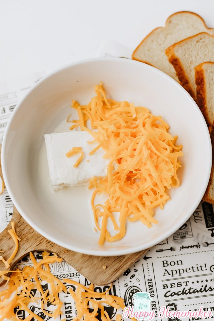 cream cheese and cheddar cheese in a bowl