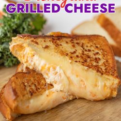 disneyland grilled cheese sandwich cut in half on a cutting board