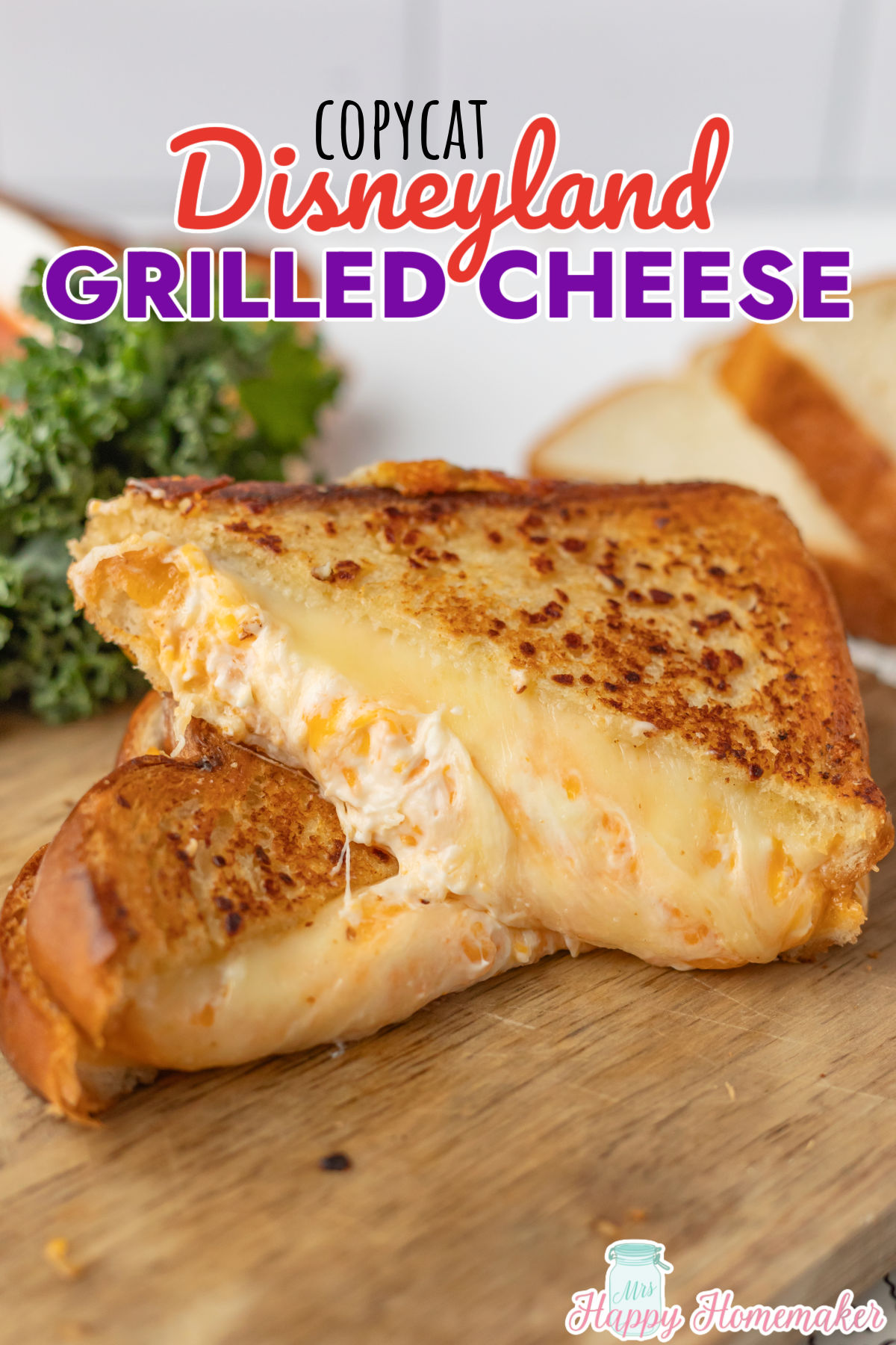 disneyland grilled cheese sandwich cut in half on a cutting board