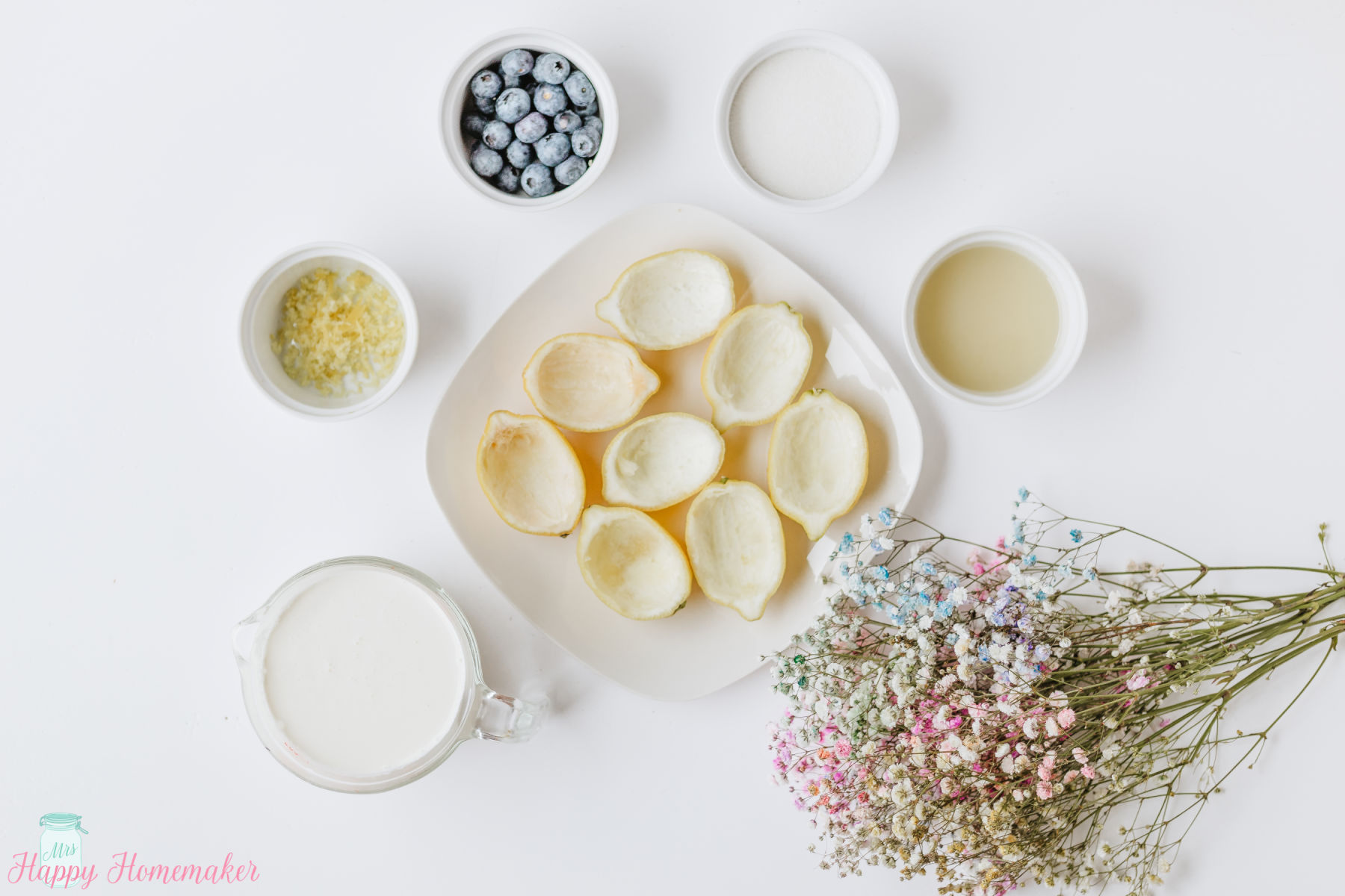 Lemon Posset ingredients in small bowls on a white counter
