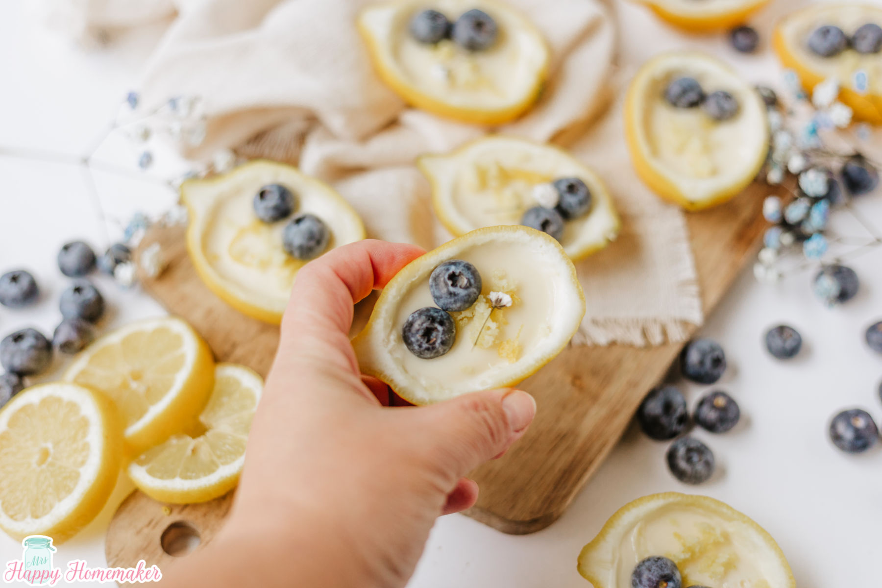 a hand holding a Lemon Posset