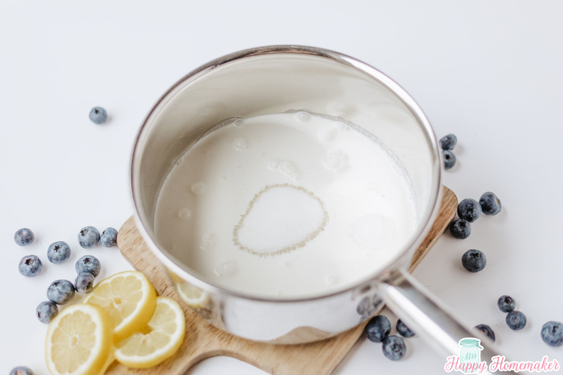 Lemon Posset cream ingredients in a small stainless steel saucepan