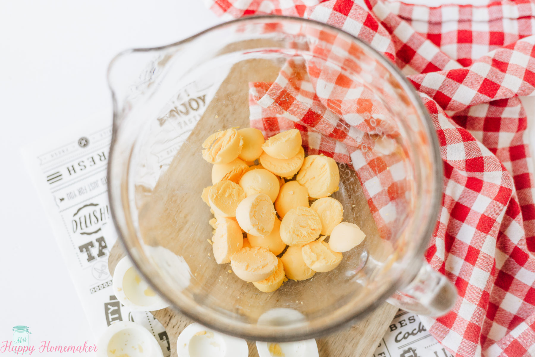Hot Dog Deviled Eggs - cooked yolks in a clear bowl