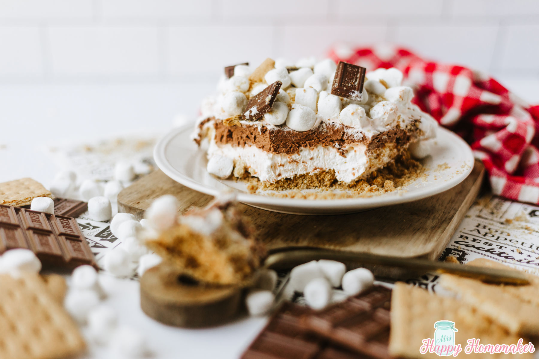 s'mores lasagna piece served up on a white plate