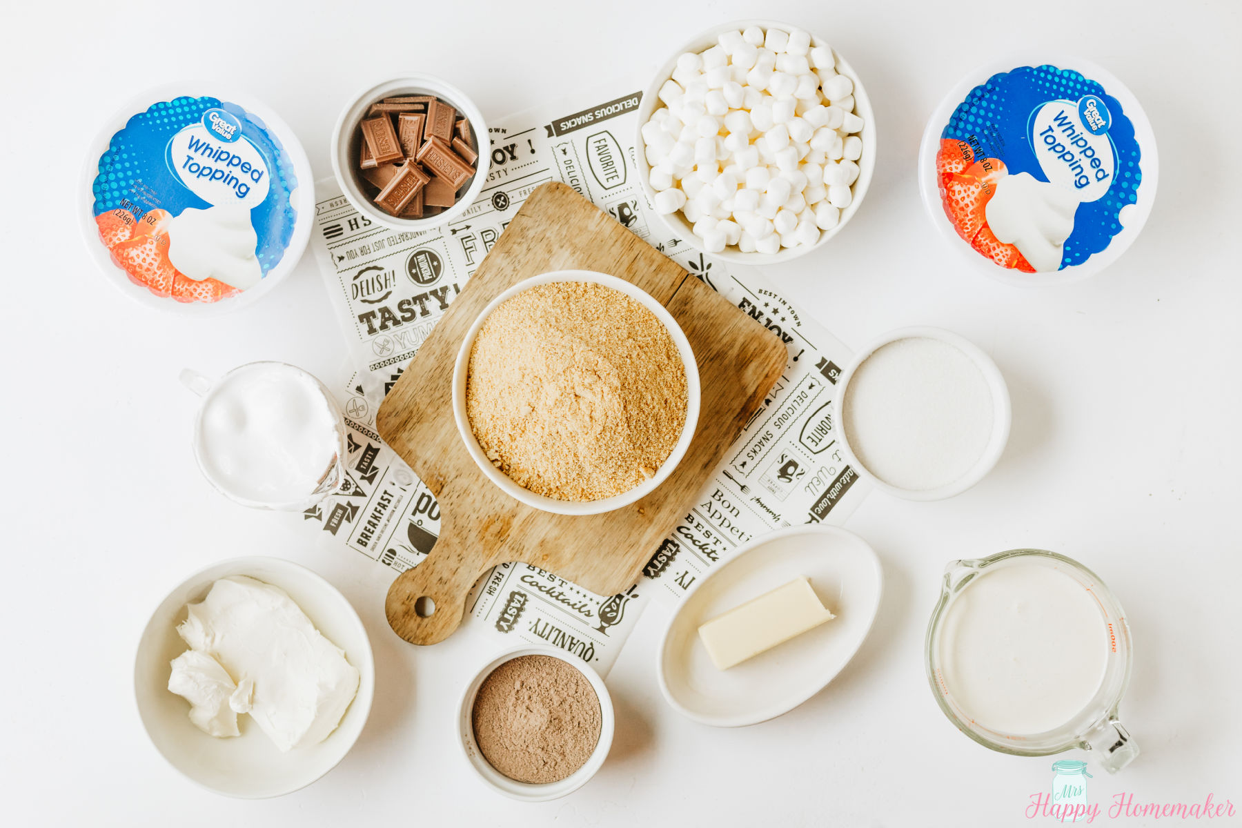ingredients to make smores lasagna lined up on a white countertop