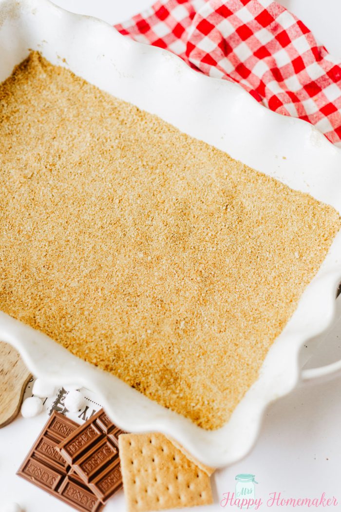 graham cracker crust pressed into a 9x13 white baking dish