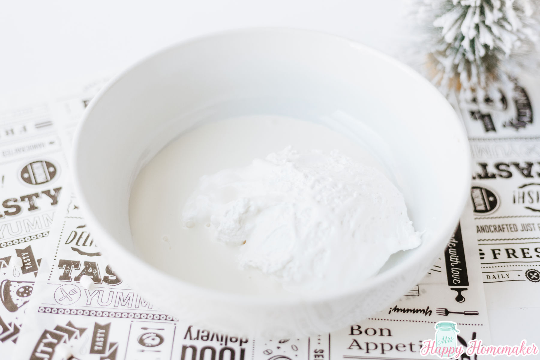 heavy cream and cool whip being mixed in a bowl