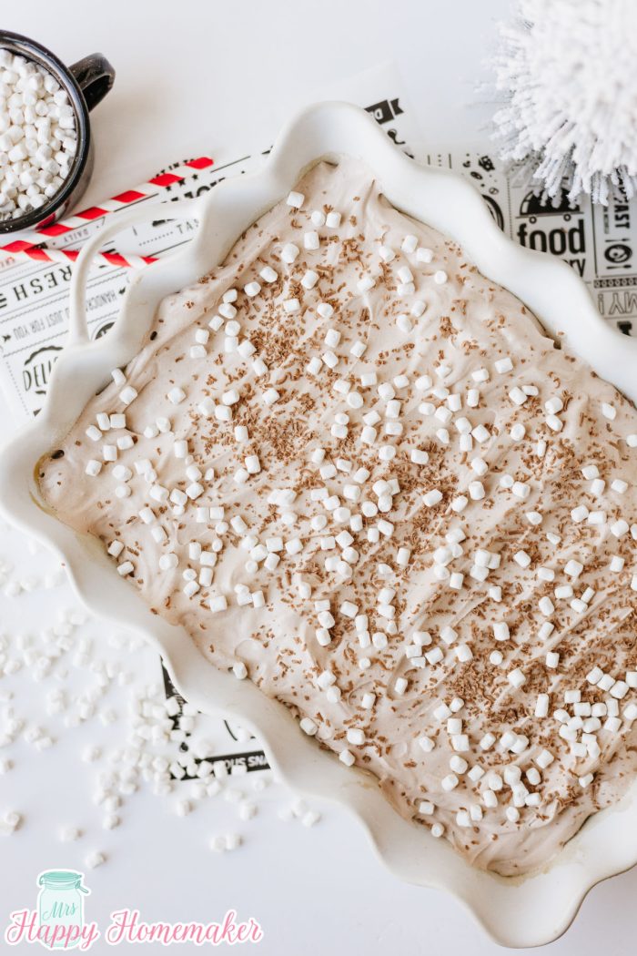 Hot Cocoa Poke Cake in a white rectangle cake dish