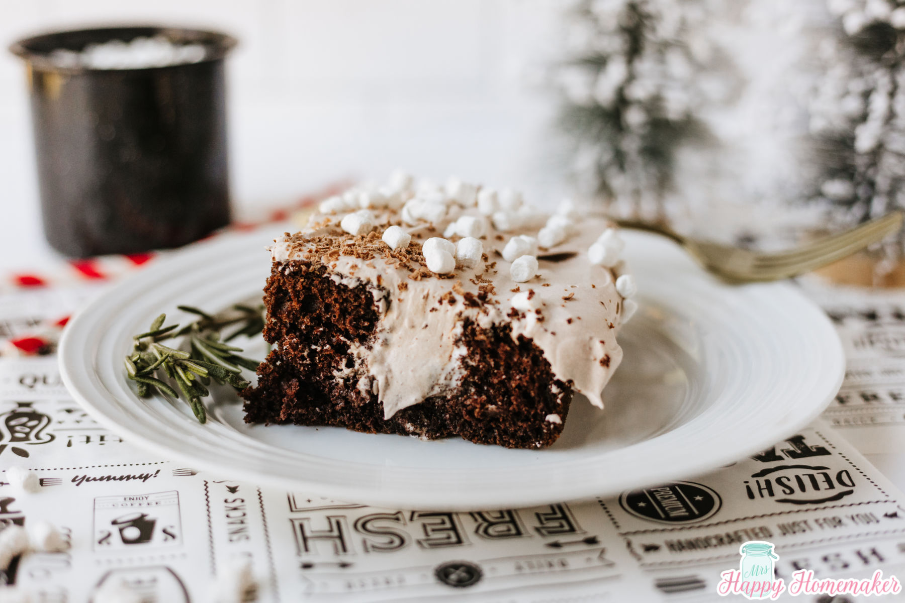 a slice of hot cocoa poke cake on a white plate