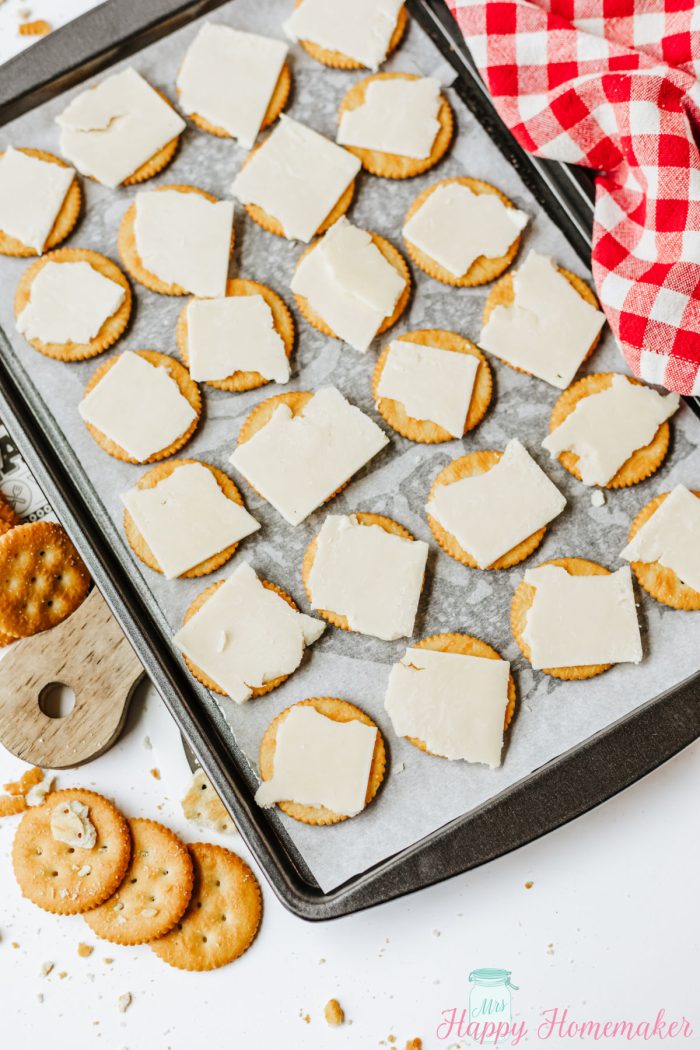 cheese on a tray of ritz crackers