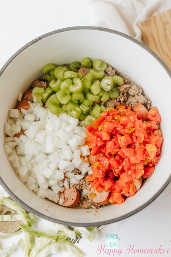 making Dirty Cabbage in a dutch oven