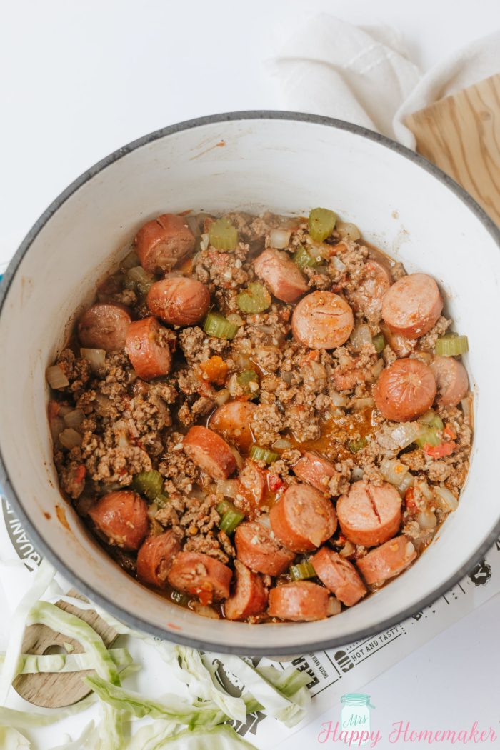 making Dirty Cabbage in a dutch oven
