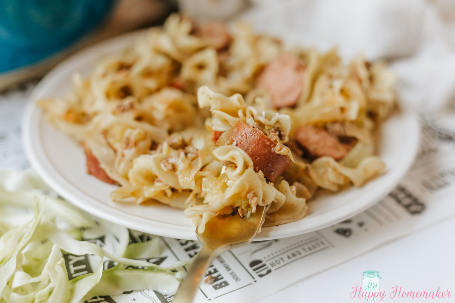 Viral Style Dirty Cabbage and Noodles on a white plate with a fork