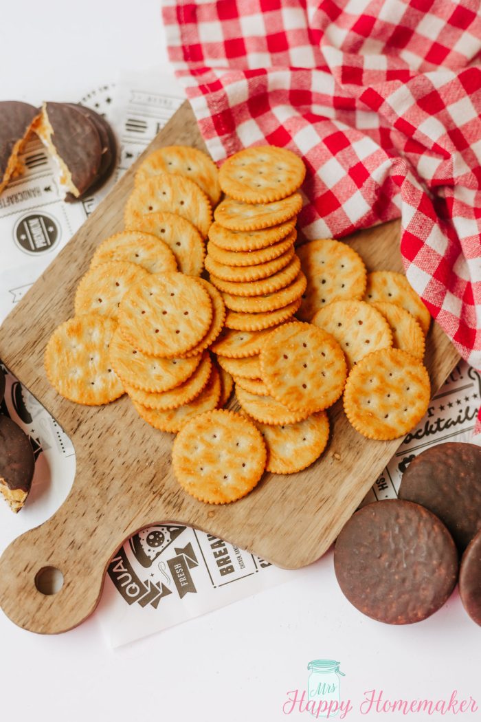 rtiz crackers piled on a cutting board