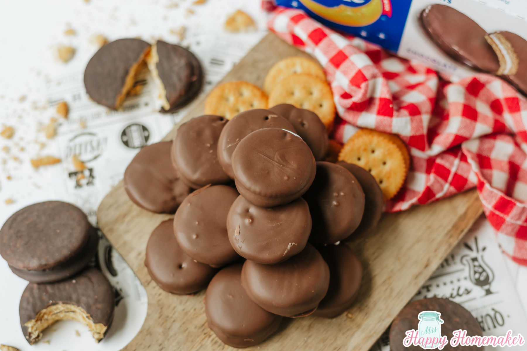 homemade 3 ingredient Moon Pies piled on a wooden cutting board
