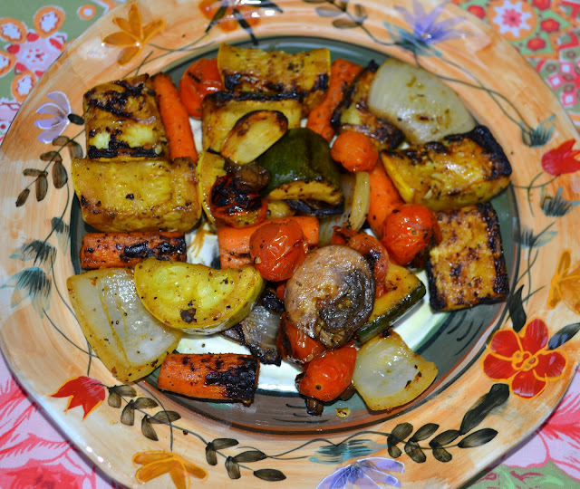 balsamic roasted vegetables on a plate - carrots, onions, zucchini, squash 