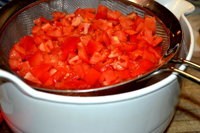 chopped tomatoes draining for salsa 