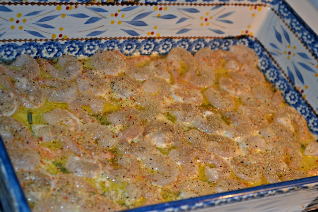 uncooked shrimp scampi in a casserole dish