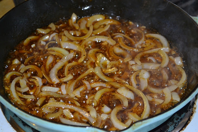 onions cooking in a pan 