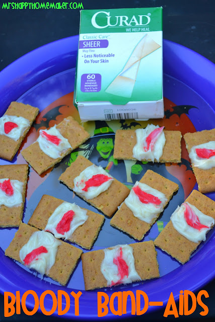 Blood Band Aid graham cracker cookies made from graham crackers, frosting, and red food coloring