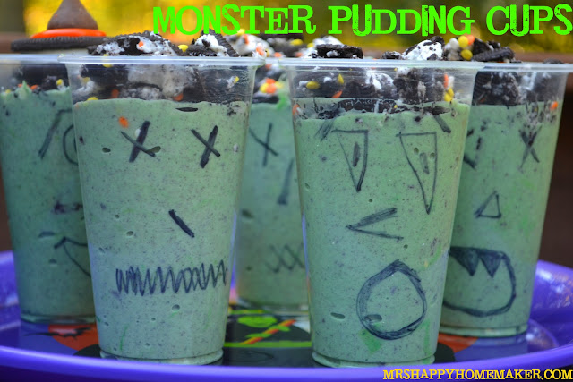 Monster Pudding Cups - green pudding topped with Oreos with clear plastic cups decorated with a black sharpie 