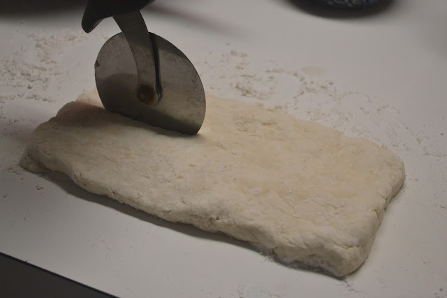 buttermilk biscuit dough being sliced