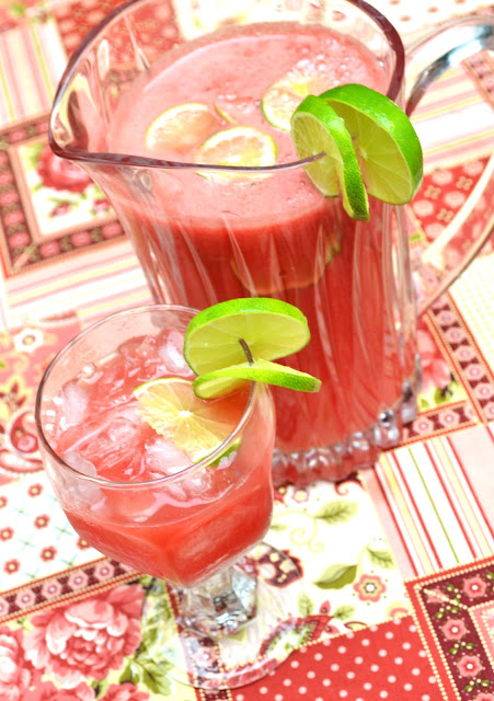 Watermelon Agua Fresca garnished with fresh lime slices 