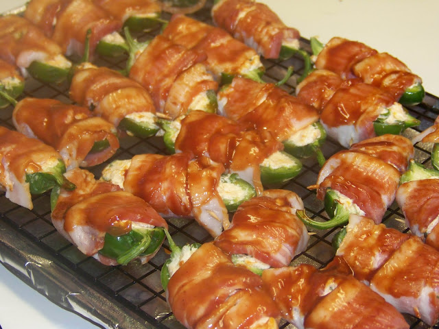 bacon wrapped jalapeno poppers on a wire rack